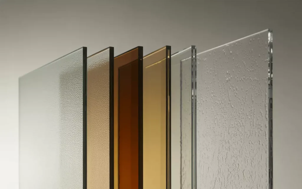 Tempered glass panels in clear, frosted, tinted, low-iron, and acid-etched finishes with polished edges and clarity.
