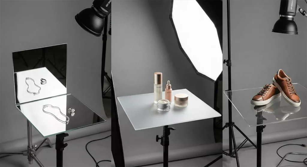 Multiple acrylic and glass sheets with jewelry, skincare, and shoes showing realistic reflections and professional lighting.