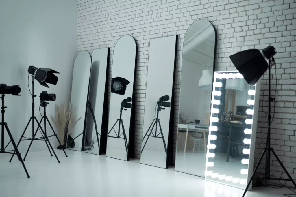 Studio setup with multiple mirror types for photography and filming, highlighting high clarity, accurate reflections, and professional creative environment.