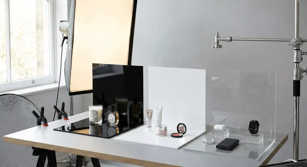 Product photography on black, white, and clear acrylic sheets with realistic reflections, shadows, and studio lighting.