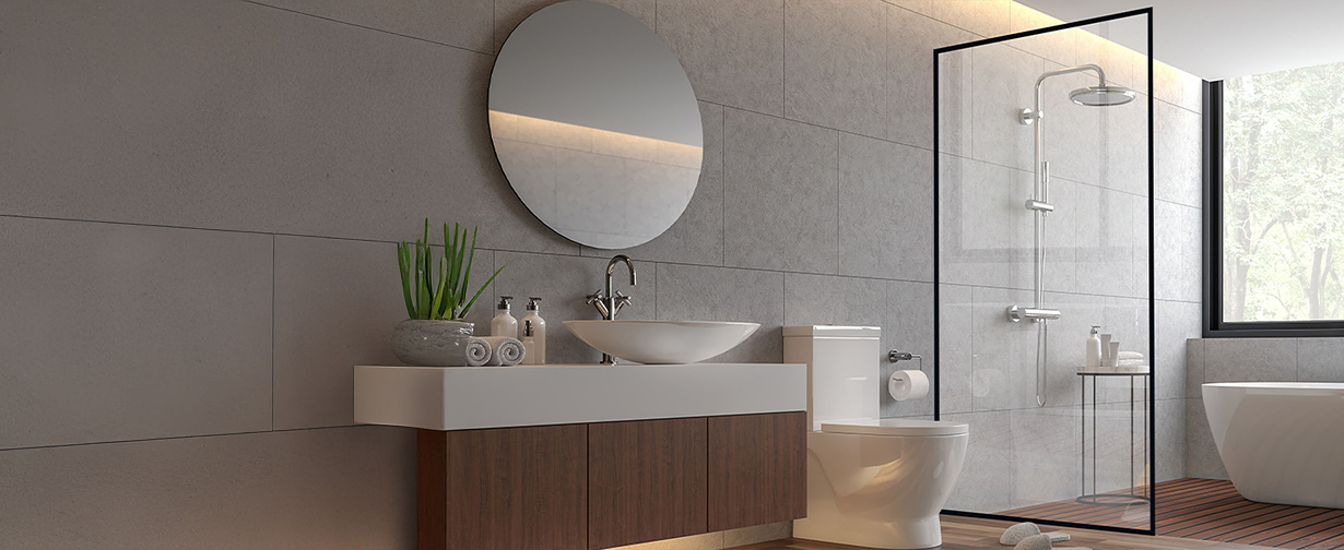 Contemporary bathroom with glass shower door, round mirror, and vanity, showcasing stylish walk in shower doors.