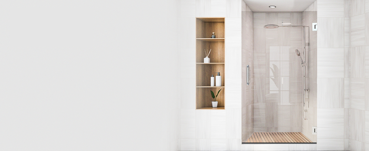 Polished chrome handle on frameless swing shower door in modern bathroom