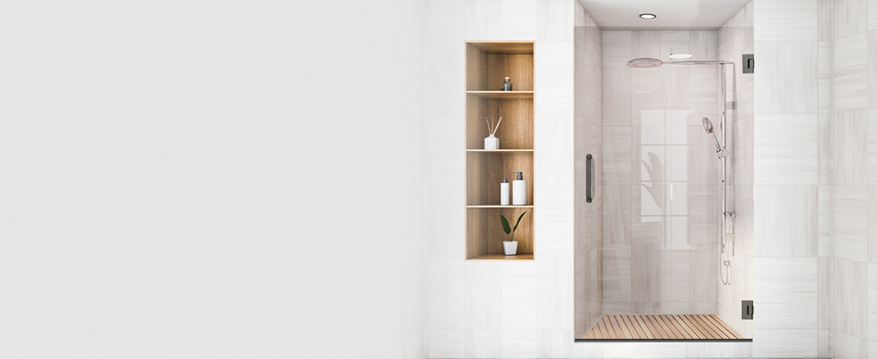Modern frameless swing shower door with brushed nickel hardware and hinges in spa-like walk-in shower