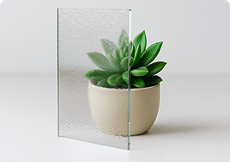 Textured patterned glass sample showcasing custom cut precision, a high-quality companion to bronze tempered glass.