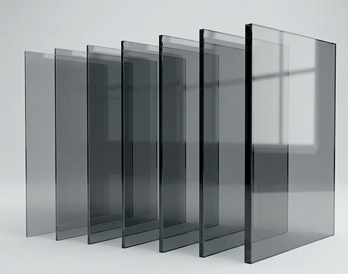 Stacked ECL tinted grey glass cut to size sheets showcasing smooth polished edges.