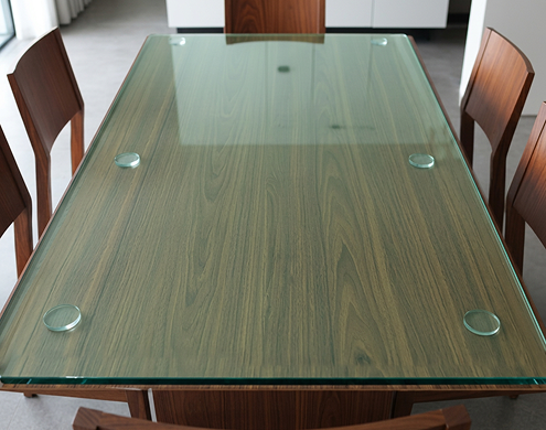 High-quality stack of green tint glass showing polished edges and thickness