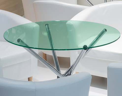 Elegant green glass sheet dining table with solid wooden base and matching chairs