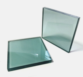 Two thick square glass panels with a greenish tint on a white background.