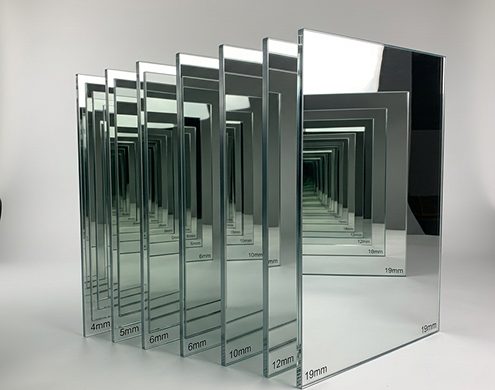 Mirrorpane tempered glass panels of varying thicknesses (4mm to 19mm) displayed in a studio