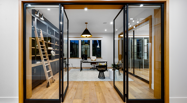 Open black-framed glass doors with Ultra Clear tempered glass leading to a stylish modern home office.
