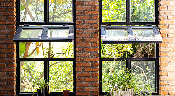 Black-framed awning windows with Ultra Clear tempered glass allowing maximum natural light and clarity