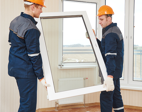 Workers install windows with Ultra Clear tempered glass for superior clarity and brightness